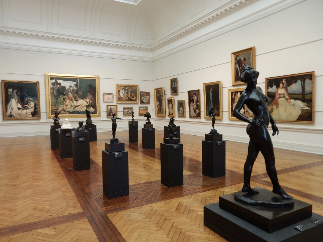 The museum has lots of paintings and statues on display