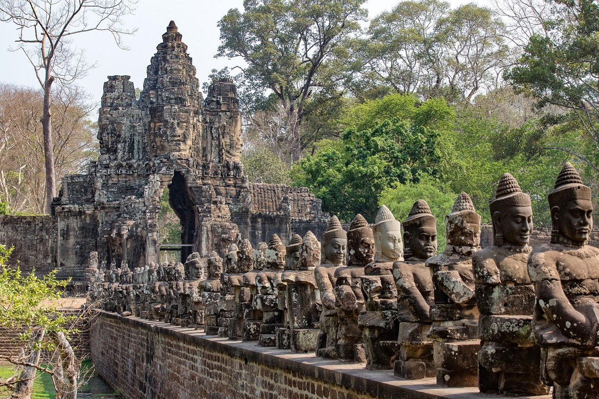 The statues of the Gods stand guard on the South Entrance of Angkor Thom